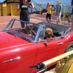 Dutch kids enjoying the ferry ride all the more in my Healey.