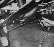 Throttle linkage inside the passenger compartent is a carryover from right-hand-drive European version.