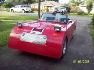 An odd mix between race car bed and Can-Am car.