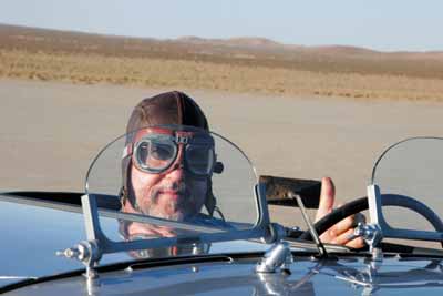 Gordon Gibbons got into the spirit of the lakebed with some original pre-WWII flying gear The goggles are necessary at high speed, as the windscreens do little to protect the driver.