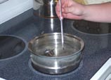 Use a pan of heated water and a thermometer to check the thermostat. The spring should begin to retract at the thermostat’s rated temperature.