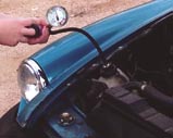The pressure tester replaces the cap, either on the radiator itself or on the expansion tank if so equipped.