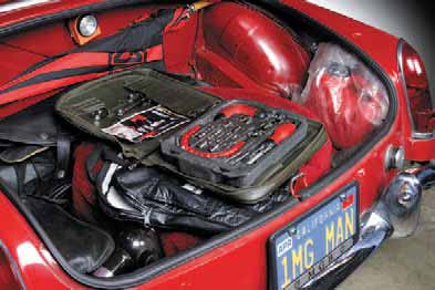 A temporary spare can free up some trunk space. (One from a Saab 900 or Datsun 240/260/280 will fit an MGB just fine.) Alternately, place your jack, lug wrench, and any spare parts that’ll fit under the stock spare tire before securing it in place. Then use a Moss Trunk Tote to organize remaining bits.