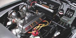 The engine has about 175,000 miles on it. Aftermarket goodies include K&N air filters, a Mallory distributor, and aftermarket plug wires.