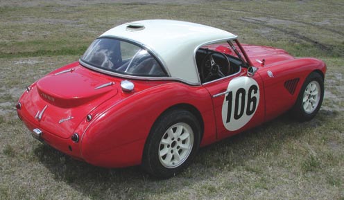 This rear view shows off the Works trunk lid that has a bustle for a second spare tire (remember, these were Rally cars). Works vented hardtop has a rear-facing vent to improve flow-through ventilation.